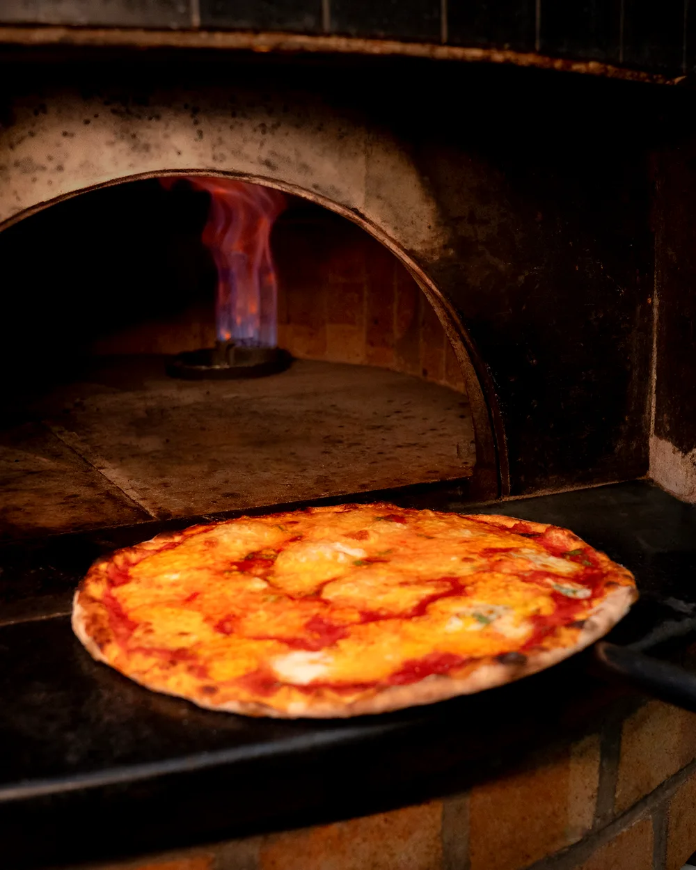 Pizza in the wood-fired oven